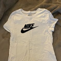 Girl’s Nike Shirt Size M, Never Worn. Nike Cotton Shirt With Letter Print, Trendy Nike T-shirt With Letter Print, Nike Basic Tops With Letter Print, Basic Nike Tops With Letter Print, Cute Nike Short Sleeve Tops, Cute Nike White Tops, Nike Basic Graphic Print Top, Nike Basic Top With Graphic Print, Cute White Nike Top