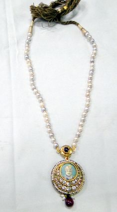 "Vintage antique 22 K solid gold and Ruby pearl Sapphire gemstone Necklace. Original old Royal piece with Maharaja (king)miniature painting inserted in very good condition. Size of pendant-3.5 cm, Length -35 cm(13.77\") end to end, free size easy to adjust the length by moving cord knot. weight-44 grams, material -22 K gold, Ruby, pearls, Sapphire." Diwali Temple Jewelry Pearl Necklace, Traditional Round Necklace With Pearl Pendant, Round Pearl Pendant Necklace For Festivals, Festival Pearl Pendant Necklace, Traditional 22k Gold Necklace With Pearl Pendant, 22k Gold Temple Jewelry Pearl Necklace As Gift, Maharaja Jewellery, Pearl Painting, Gold Amulet