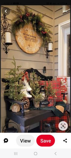 an image of a porch decorated for christmas with wreaths and pine cones on the bench