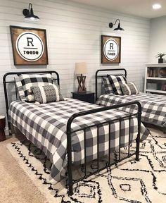 two beds in a room with black and white checkered sheets on the bedding