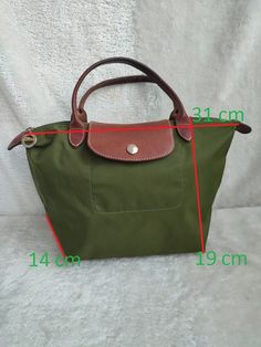 longchamp tote bag with small handles,green color, size 31cm*19cm*14cm, nylon material, good condition, there are slight scuffs on the corners see the latest photos, inside the bag is clean,without smell women's bag Longchamp Bag Outfit, Long Champ Bag, Longchamp Tote Bag, Longchamp Tote, Longchamp Bag, Bag Interior, Bag Green, Green Bag, Cloth Bags