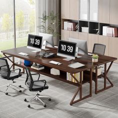 an office desk with three computer monitors on it and two chairs in front of the desk