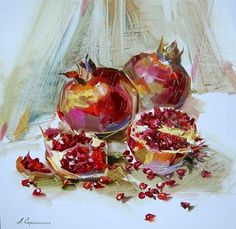 three pomegranates are sitting on a table