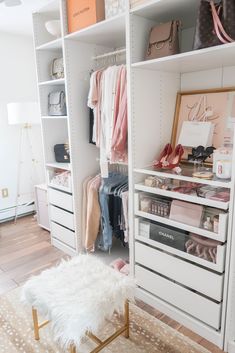 an organized closet with white shelving and pink accessories on the shelves, including shoes