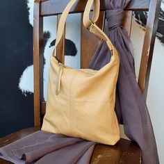 The URBAN bag 100% Genuine Leather handbag Butter Yellow Small 21cm or 8 inches wide at bottom 23cm or 9 inches height 3 cm or 1.25 inch deep Medium 26cm or 10 inch width at bottom 28 cm or 11 inch in height 4cm 1.75 inch deep Large 30cm or 12 inches width at bottom 33cm or 13 inches height 5 cm or 2 inches deep SPECS -Hobo handmade handbag, made from a new quality upholstery leather remnant sourced locally   Stitch detail on main body and strap  Magnetic snap closure Or Zipper closure   Lined i Cream Leather Hobo Bag For Everyday, Beige Leather Crossbody Hobo Bag, Cream Shoulder Bag For Everyday Fall Use, Beige Hobo Bag With Handle Drop For Everyday Use, Everyday Soft Leather Crossbody Bucket Bag, Cream Leather Bucket Bag For Everyday Use, Soft Leather Crossbody Bucket Bag For Everyday, Cream Leather Bucket Bag, Everyday Cream Leather Bucket Bag