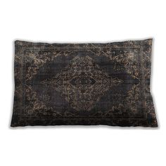 an antique black and gold pillow on a white background with a decorative design in the middle