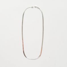 Our silver herringbone chain necklace is the ultimate maximalist piece - a timeless classic that exudes sophistication and glam. Available in two lengths so you can style it solo or double it up. -- available lengths: 16" and 18" width: 3.5mm sterling silver This shiny gal requires extra care to keep her looking her best. The chain is constructed of individually woven and flattened links so it should always be removed before bed and stored flat. Classic Silver Snake Chain Necklace For Everyday, Silver Classic Snake Chain Necklace, Classic Sterling Silver Snake Chain Necklace, Minimalist Snake Chain Necklace With Sterling Silver Clasp, Silver Minimalist Herringbone Necklace, Silver Minimalist Herringbone Necklace With Box Chain, Silver Metal Snake Chain Necklace, Silver Metal Herringbone Necklace, Classic Silver Snake Chain Necklace