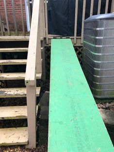 a green ramp leading up to some stairs