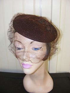 Retro Wedding Hat Fascinator, Retro Wedding Fascinator Hat, Vintage Brown Formal Hat, Vintage Cloche Fascinator For Wedding, Fitted Wide Brim Vintage Cloche Hat, Vintage Cloche Wedding Hat, Vintage Fitted Wide Brim Cloche Hat, Fitted Retro Brown Cloche Hat, Vintage Wide Brim Fitted Cloche Hat