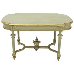 an antique console table with gold trimming