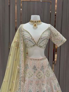 Be the daring bride and steal the show with our Bridal Lehenga BL-283! In a stunning peach color with intricate mirror work, this lehenga is perfect for your sangeet night. Make a statement and embrace your adventurous side with this bold and beautiful piece! Fabric: Organza! WASH CARE INSTRUCTIONS - Please Dry clean only when it is applicable! Ready to Ship! Peach Anarkali Set For Reception With Traditional Drape, Peach Lehenga With Traditional Drape For Reception, Traditional Drape Peach Lehenga For Reception, Floor-length Peach Lehenga For Reception, Peach Floor-length Lehenga For Reception, Floor-length Peach Choli For Reception, Floor-length Anarkali Choli In Peach, Peach Sharara For Diwali Reception, Elegant Peach Designer Wear Lehenga