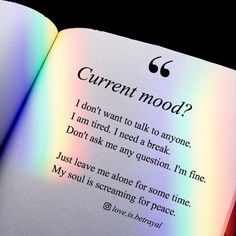 an open book with the words current mood written in rainbow - hued letters on it