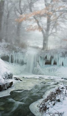 a frozen waterfall in the middle of winter