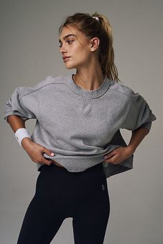 So essential and made to wear everywhere, this classic sweatshirt is featured in a slightly cropped length and boxy fit with seam detailing throughout. **Fit:** Boxy, relaxed fit, slightly cropped **Features:** Soft fabrication, pullover style, classic crew neckline, drop shoulder sleeves **Why We | Intercept Pullover by FP Movement at Free People, Heather Grey, XS Short One Piece, Solid Hoodie, Free People Activewear, Flared Leggings, Fp Movement, Top Graphic Tees, Workout Sweatshirt, Bottom Clothes, Style Classic