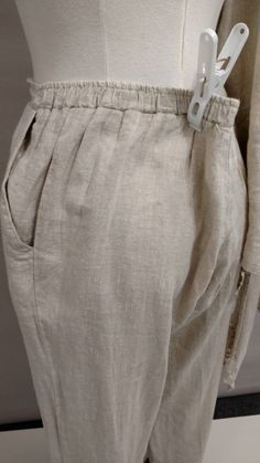 "Great natural nubby linen on this made in USA set by Match Point. Fun ruffled edge on jacket and pants hem. Side pockets on pants. Size marked Large please go by measurements. Jacket length 26.5\", bust 45\" tied tight, looks nice with a gap too. Sleeves 19\" from shoulder seam, bracelet length. Pants waist 32\"-38\", solid band in front elastic in back. rise 15\", inseam 25.5\", waist to hem 37\", hem circumference 24\". Condition excellent, no stains or damage. Machine wash and dry." Cream Linen Pants With Pockets, Fitted Linen Bottoms With Ruffles, Classic Linen Flax-colored Bottoms, Linen Wide-leg Pants With Patch Pockets, Mid-rise Linen Pants With Pockets, Rayon Wide-leg Pants With Elastic Waistband, Natural Linen Pants, Match Point, Linen Pants