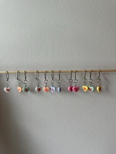 a row of heart shaped key chains hanging on a wall