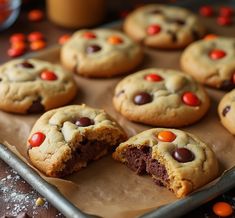 chocolate chip cookies with m & m's and candy eyes on top are ready to be eaten