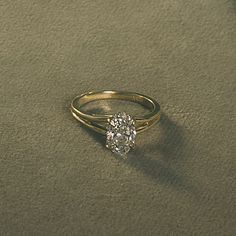 a gold ring with a diamond on it