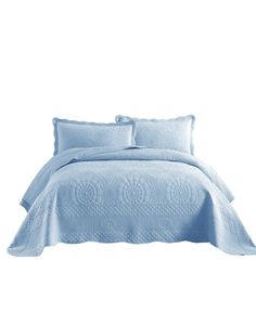 a bed with blue comforter and pillows on top of the sheets in front of a white background