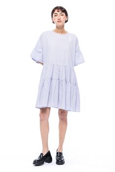 Our Boden Short Dress is designed for an oversized and playful look with a shortened length, featuring lots of shirring, volume, and ruffle details. Short Dress White, Tier Skirt, Tiered Skirt, Tie Backs, Tie Back, Short Dress, Round Neckline, Blue Dresses, Fitness Models