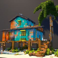 a blue house with trees and plants in front of it on a cloudy day at night