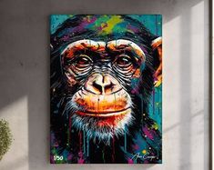 a painting of a chimpan on a wall next to a potted plant