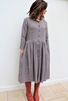 This season Voy refreshes classic silhouettes. The linen shirt dress has a softly tailored top, gently gathered skirt, flattering 3/4 length sleeves and the all essential Voy side pockets. For a contemporary twist, wear with brogues/boots. Classically edgy...... Handmade in our studio to order This item is made to order with a lead time of 5-10 working days Fall Linen Shirt Dress For Work, Relaxed Fit Linen Dress For Work, Linen Midi Shirt Dress For Fall, Linen Shirt Dress With Button Cuffs For Work, Fall Linen Midi Shirt Dress, Elegant Linen Shirt Dress For Fall, Linen Dresses With Button Cuffs For Work, Linen Midi Dress For Work In Fall, Fall Linen Relaxed Fit Shirt Dress