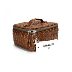 Chanel Copper Python Snakeskin Jewelry Travel Tote Removable Pouch Authentic Rare Card #16359606 Outer: Python Snakeskin Lining: Microsuede Pouch: Microsuede Top Carry Flat Leather Handle Two-Way Zipper Closure Lift Open Top With Silver-Tone Zip-Around Closure Silver-Tone "Cc" Charm & Snakeskin Leather Zipper Pull Inner Top With Rolled Slots For Necklace/Bracelets Interior Top With A Skinny Pouch For Earrings Removable Microsuede Open Pouch With 2 Zipper Pockets New With Tags Approx. Measurement Designer Rectangular Cosmetic Bag For Travel, Designer Rectangular Cosmetic Bag For Daily Use, Luxury Square Box Bag For Travel, Luxury Brown Rectangular Cosmetic Bag, Designer Cosmetic Bag With Removable Pouch, Designer Rectangular Cosmetic Bag With Removable Pouch, Luxury Brown Cosmetic Bag For Daily Use, Designer Formal Cosmetic Bag Rectangular, Luxury Brown Cosmetic Bag For Travel