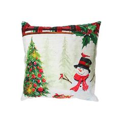 a pillow with a snowman and christmas tree on it