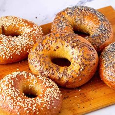 bagels with sesame seeds on a cutting board