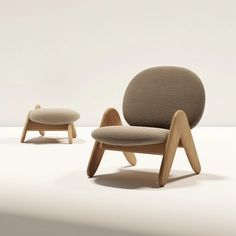 the chair and ottoman are designed to look like they have been made out of wood