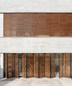 an empty building with wooden slats on the outside