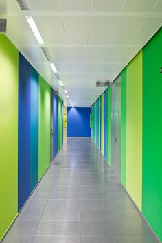 an empty hallway with green and blue walls