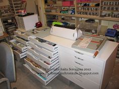 an office desk with many drawers and papers on it