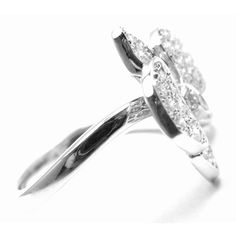 Cartier Caresse D'orchidées Orchid Flower 18k White Gold Diamond Ring  Metal: 18k White Gold  Width: 16mm  Weight: 7.3 grams  Size: European 52, US 6  Stones: 49 round brilliant cut diamonds VS1 clarity, E color total weight approx. .54ct  Hallmarks: Cartier 750 52 OG1305 T1125enad  Dimensions reference the ring size and are not specific to the ring itself. Cartier White Diamond Ring Elegant, Cartier White Diamond Wedding Ring, Cartier Diamond Ring With Pave Setting For Wedding, Elegant Oval Cartier Rings, Luxury Butterfly Ring With Brilliant Cut For Wedding, Cartier Cubic Zirconia Wedding Rings, Cartier Oval Rings Fine Jewelry, Cartier Oval Fine Jewelry Rings, Elegant Cartier Cubic Zirconia Ring