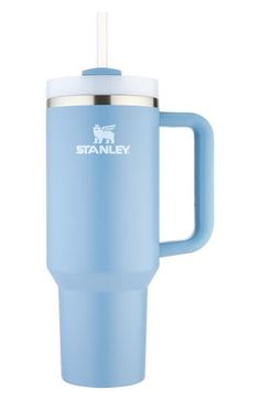 the stanley travel mug is light blue and has a stainless steel lid