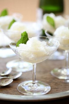 small dessert dishes with spoons on a table