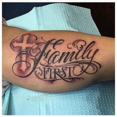 a tattoo with the words family first on it