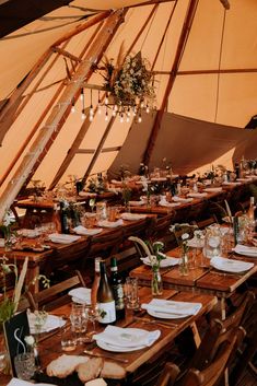 a large tent with tables and chairs in it