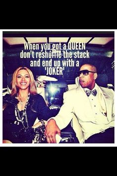 a man and woman sitting next to each other in front of a sign that says when you got a queen don't reshaffle the stack and end up with a joker