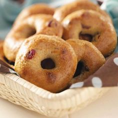 a basket filled with donuts sitting on top of a table