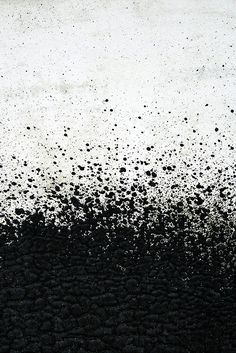 an abstract black and white painting with lots of dots