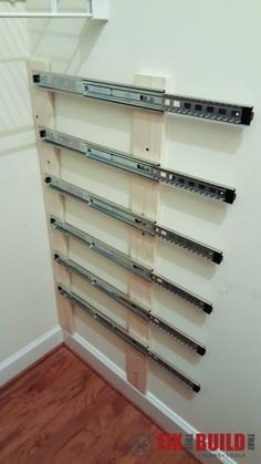 a wall mounted shelf with metal brackets on it