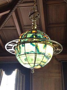 a chandelier hanging from the ceiling in a room