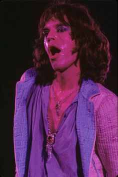 a man with his mouth open on stage