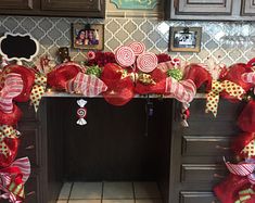 a fireplace decorated for christmas with candy canes and bows