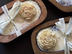 three wooden trays with flowers in them