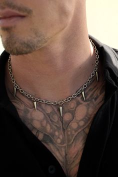 100% stainless steel cable chain adorned with hanging spikes. Fits any alternative, goth, or e-boy/e-girl aesthetic. Made for the long run, this necklace will last long enough to pass down and most importantly, never turn your skin green. 6mm x 19in. + 3in. adjustable Jewelry For Men Necklaces, Edgy Aesthetic Grunge, Streetwear Jewelry, E Girl Aesthetic, Goth Necklace, Edgy Aesthetic, Boys Jewelry, Cable Chain Necklace