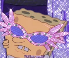 the spongebob is wearing pink sunglasses