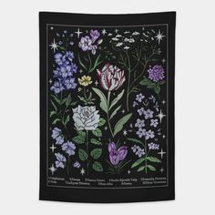 a black wall hanging with flowers and stars